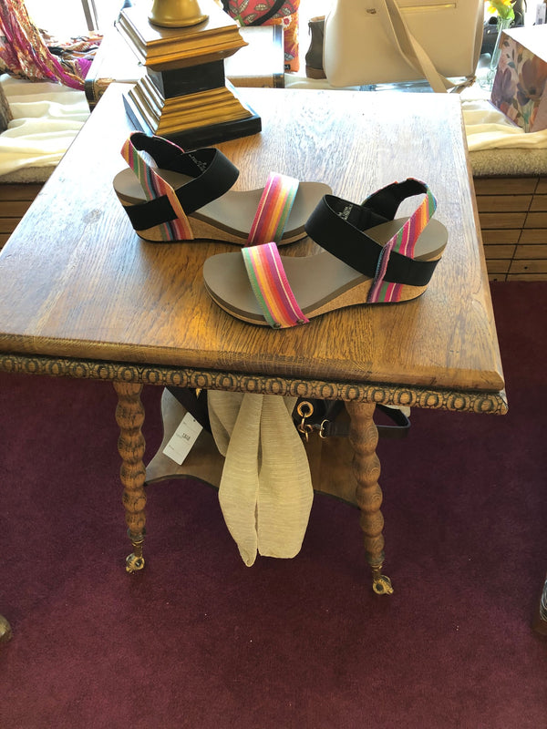 Effie Rainbow Wedge | Rainbow and black wedge  Elastic strap around upper and ankle  Medium cork heel