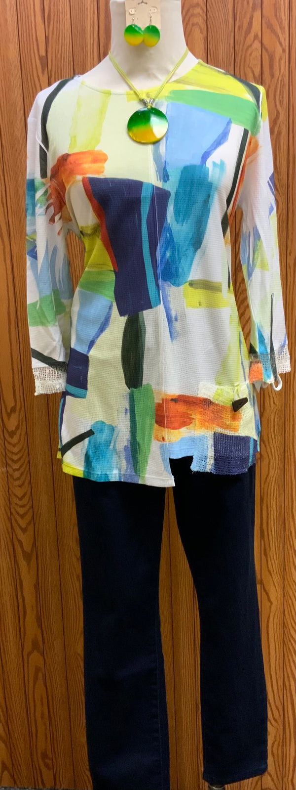 Susan Watercolor Top | Crafted from a textured crepe fabric and printed with a dreamy watercolor design, this top is perfect for a day out shopping or a night on the town. It even has a unique mesh pocket on the left hip and a mesh trim on the sleeves to add an extra dose of originality.   Machine washable   Made in the USA  Available Small - 3X 