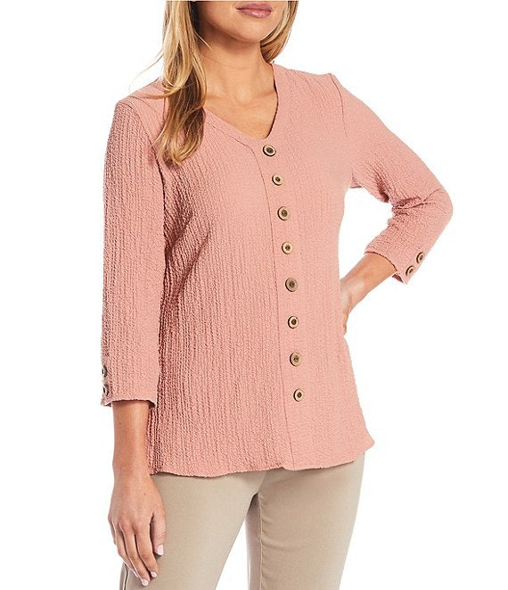 Sandra textured top | A richly textured yet, lightweight pucker fabric is the perfect fit to your closet.  Salmon in color with a v neckline and 8 button detail going down the front.  Machine washable   Available 1x - 3X 