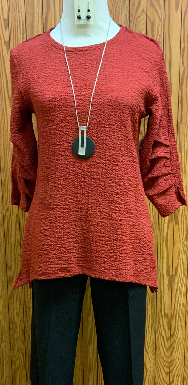 Hattie Top | Bubble fabric, our favorite!!  Travel away for the weekend in this 3/4 sleeve top with 4 button detail on the sleeve.  You’ll sure to fall in love with this top.  Pair with jeans, dress pants, or capris; this top can go anywhere!  Available in 2 colors- black and brick  Machine washable   Available Small - Extra Large 